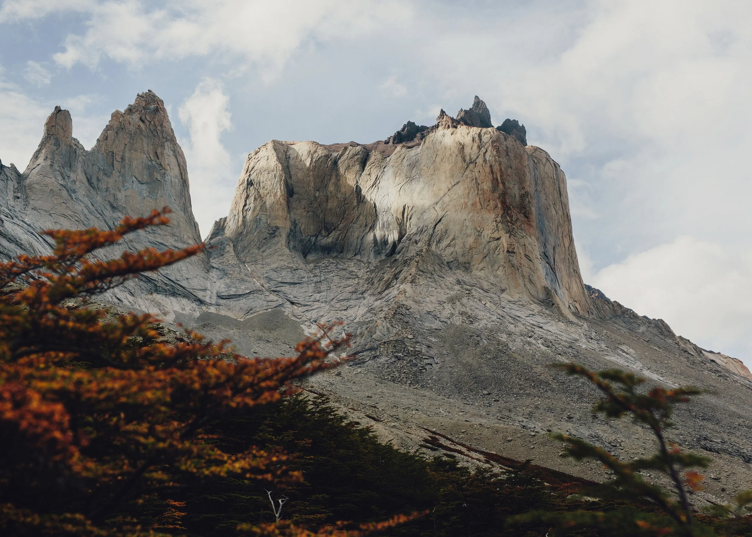 Los Cuernos Mountains - hard, resistant granite (igneous) dramatic black caps cover the older Cretaceous era shale from the bottom of the ocean 12.5 million years ago, which was later sculpted by glaciers into the iconic point. So those mountains tel