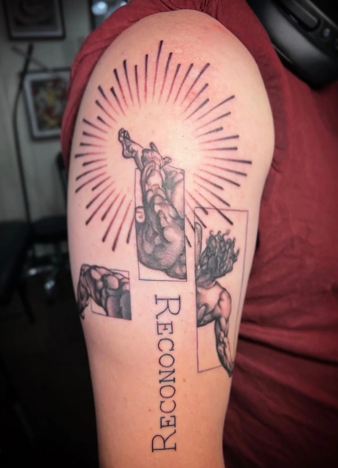 A stylized black and grey realism tattoo on the upper arm of a man with rays and lettering by portland tattoo artist at Upper Moon Tattoo, Daniel Aispuro