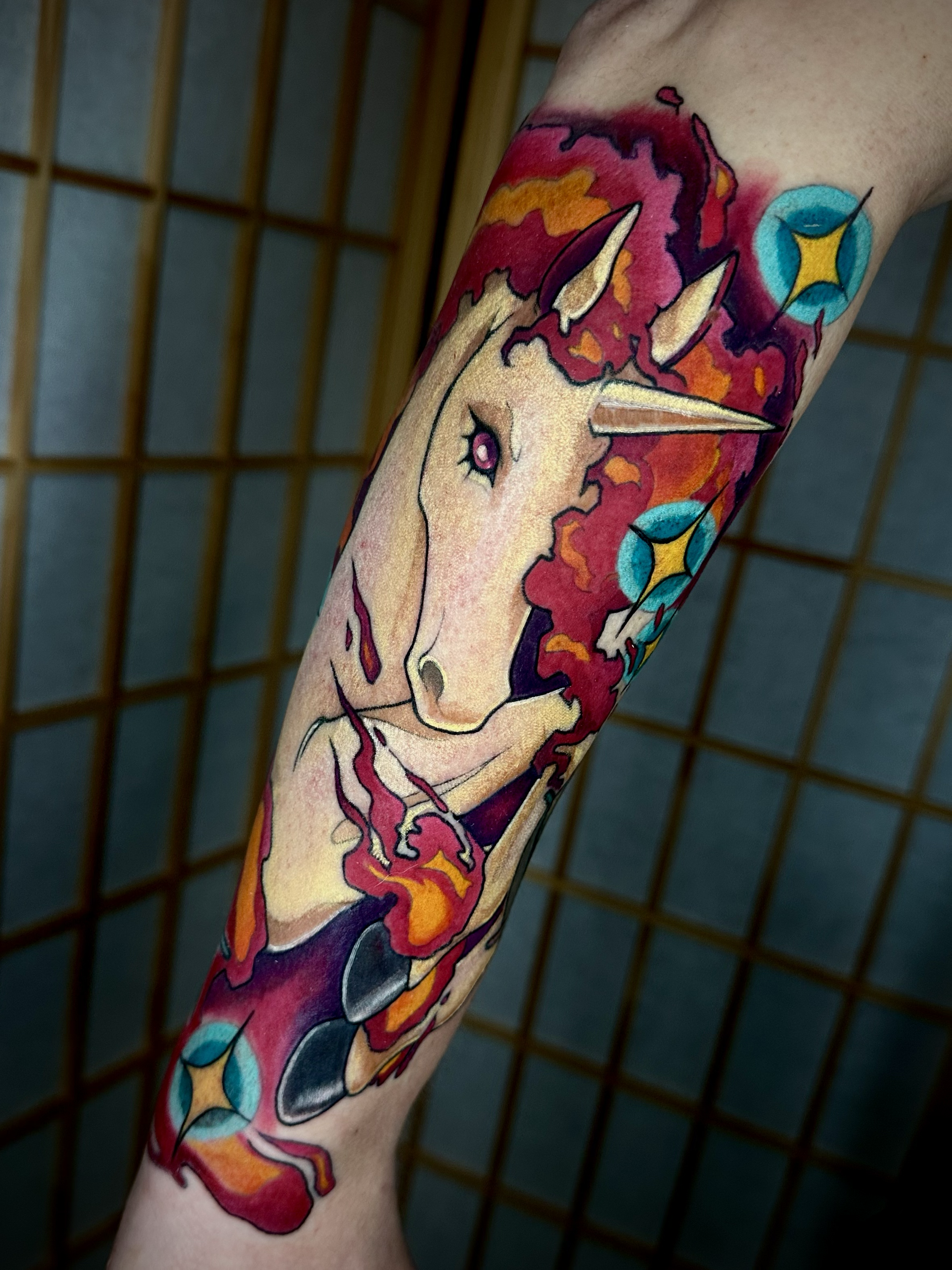 Forearm color tattoo of Pokemon Rapidash with flames  by Portland Tattoo artist at Upper Moon Tattoo Rae Syndulla 