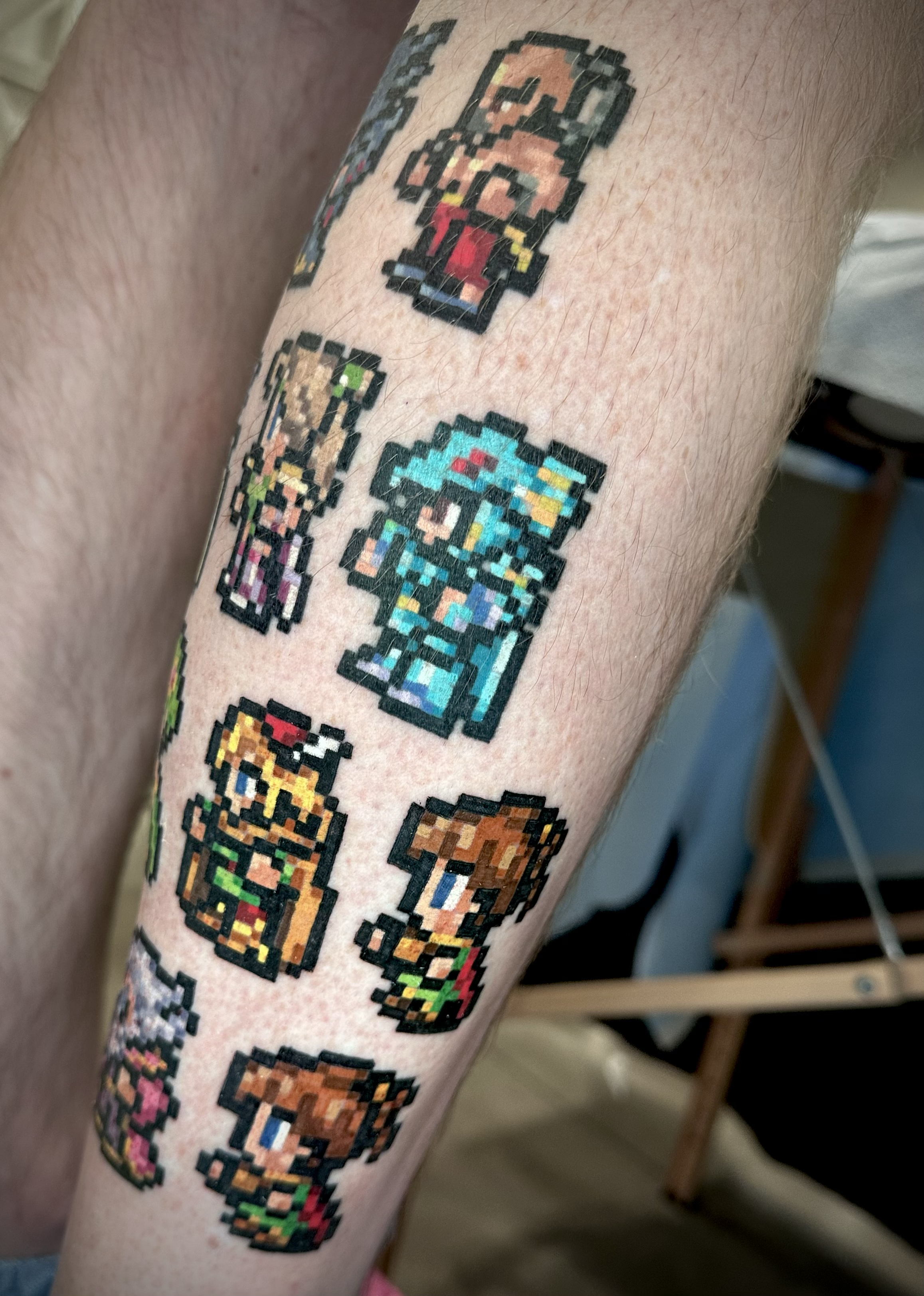 Pixelated color tattoos on the leg of Final fantasy characters final fantasy 4, 7, 11, 14 tattoo  by Portland Tattoo artist at Upper Moon Tattoo Rae Syndulla 