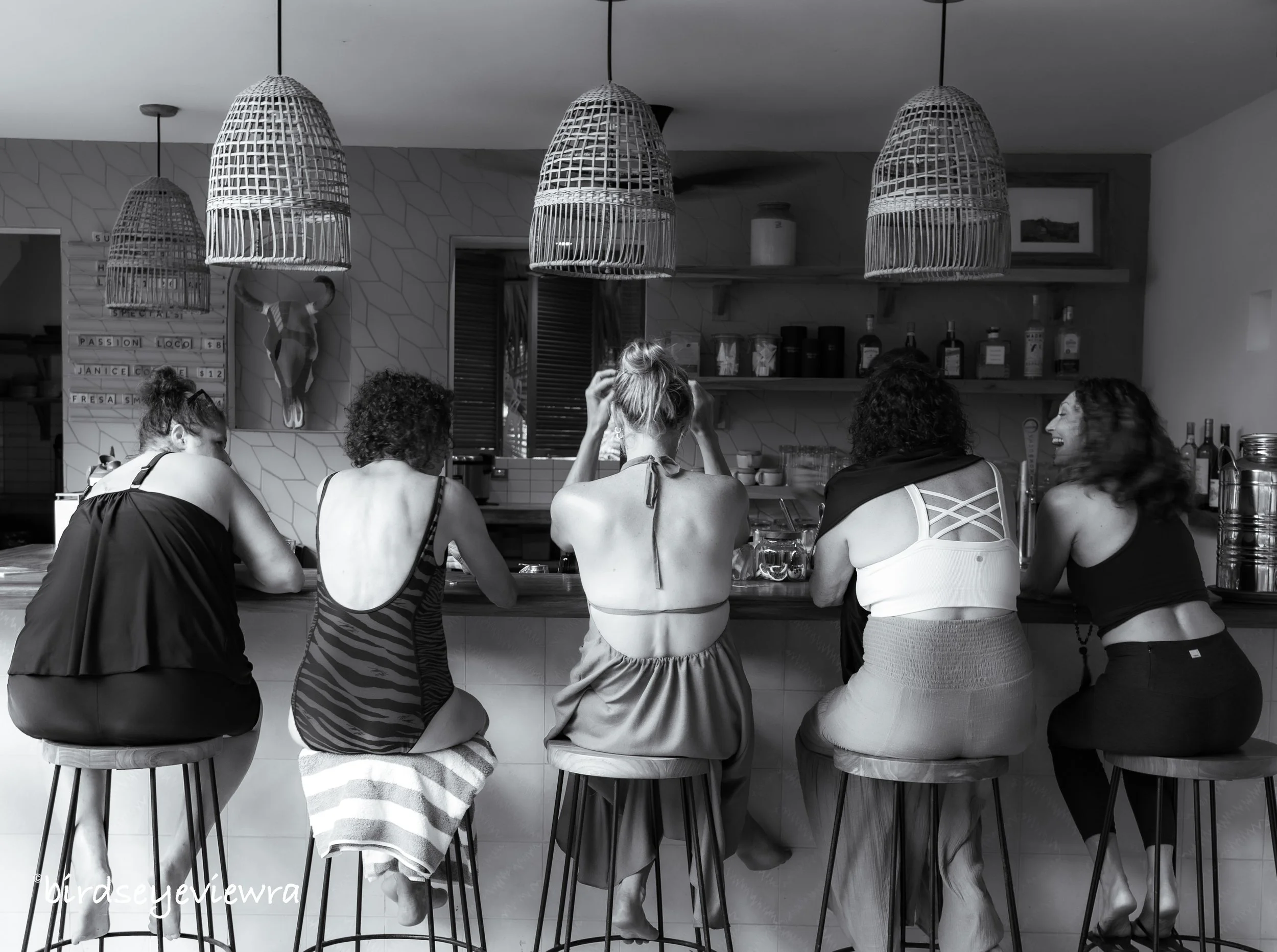 After all the yoga and excursions, a community moment at Nomadic's bar in Playa Guiones