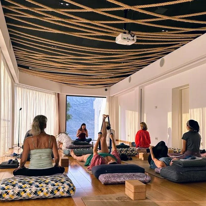 A restorative yoga class following an earlier ashtanga class at Earth + Sky, Aegialis Hotel, Amorgos, Greece