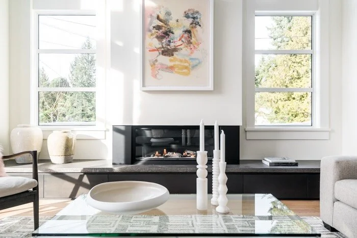 Really liked how these windows flanking the fireplace captured some extra natural light and created some different outlooks at our Cedarmill, QB project