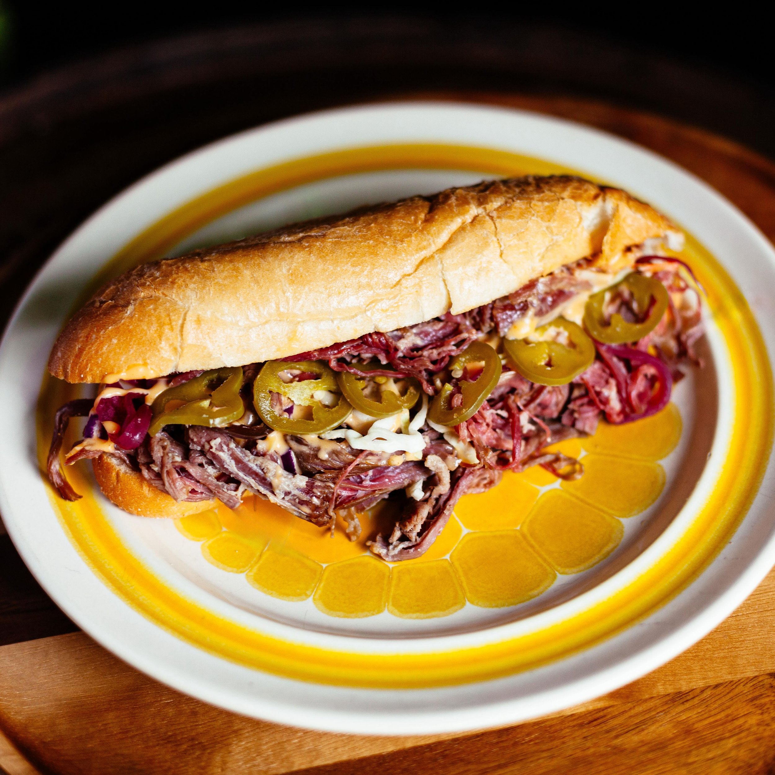 Last weekend to snag this beef and cheedah ☝️aka the beefy bastard 2.0. 

We are replacing it with a Reuben of the redneck variety. 

On deck for specials: 
Swamp Dawg (a Cajun chili dawg) $14
House made Andouille
Cajun gravy
Green onion for pizazz 
