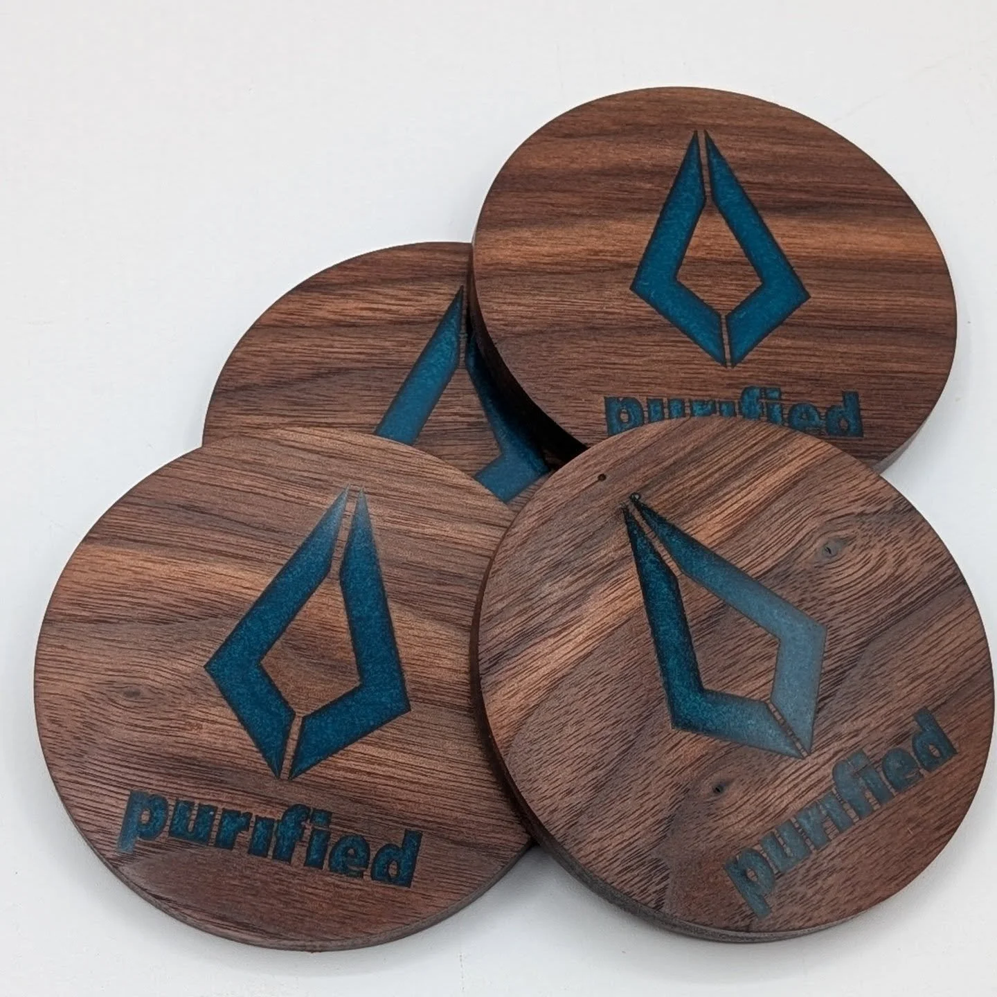 A set of custom-made solid Canadian reclaimed walnut coasters, engraved with the Purified Records logo and filled with tinted epoxy.

Created as a special gift for the incredible @noraenpure and Toronto&rsquo;s own @adinanovamusic 💿💫

A little piec