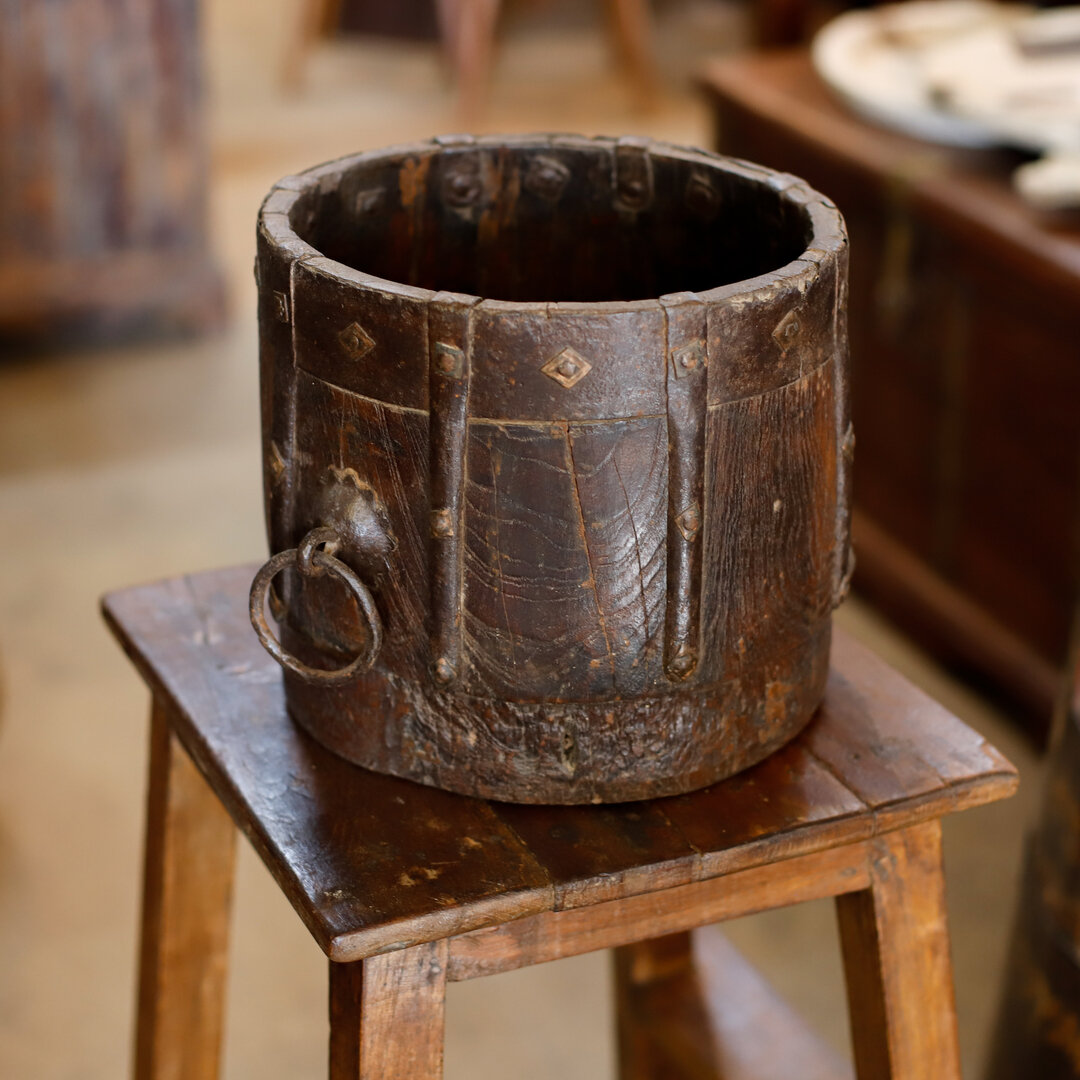 Indian mana pots are handmade wooden vessels originally used to measure grain and other commodities. ​​​​​​​​​
Rescued from the streets of India and brought back to the Vanguard warehouse, these pots are great for planters or storing trinkets. 

Visi