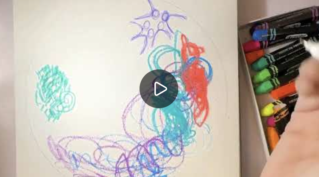 Colorful scribbles and drawings made with markers on a sheet of paper, with a box of markers visible on the right side.