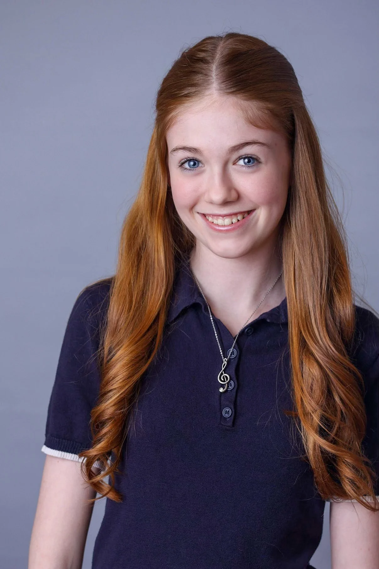 Raewyn Headshot - blue collar brighter.JPEG