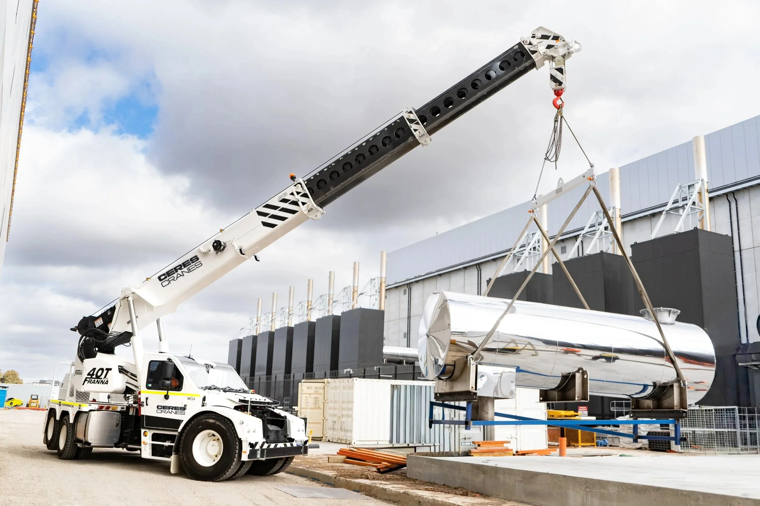 Ceres Cranes 40T Franna AT40 lifting a large steel tank on a building site