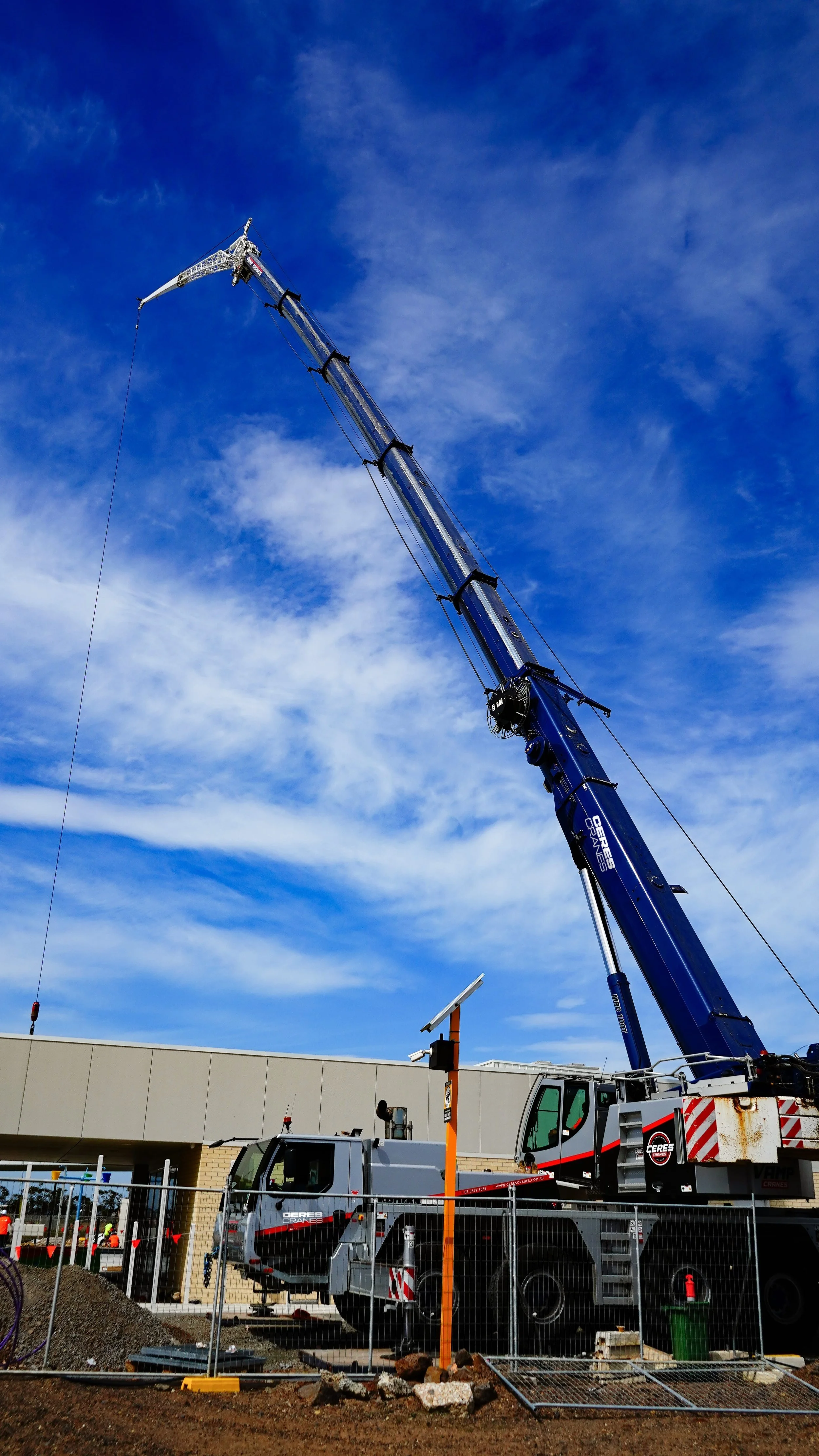 Ceres Cranes 100T Liebherr with boom extended on a construction site