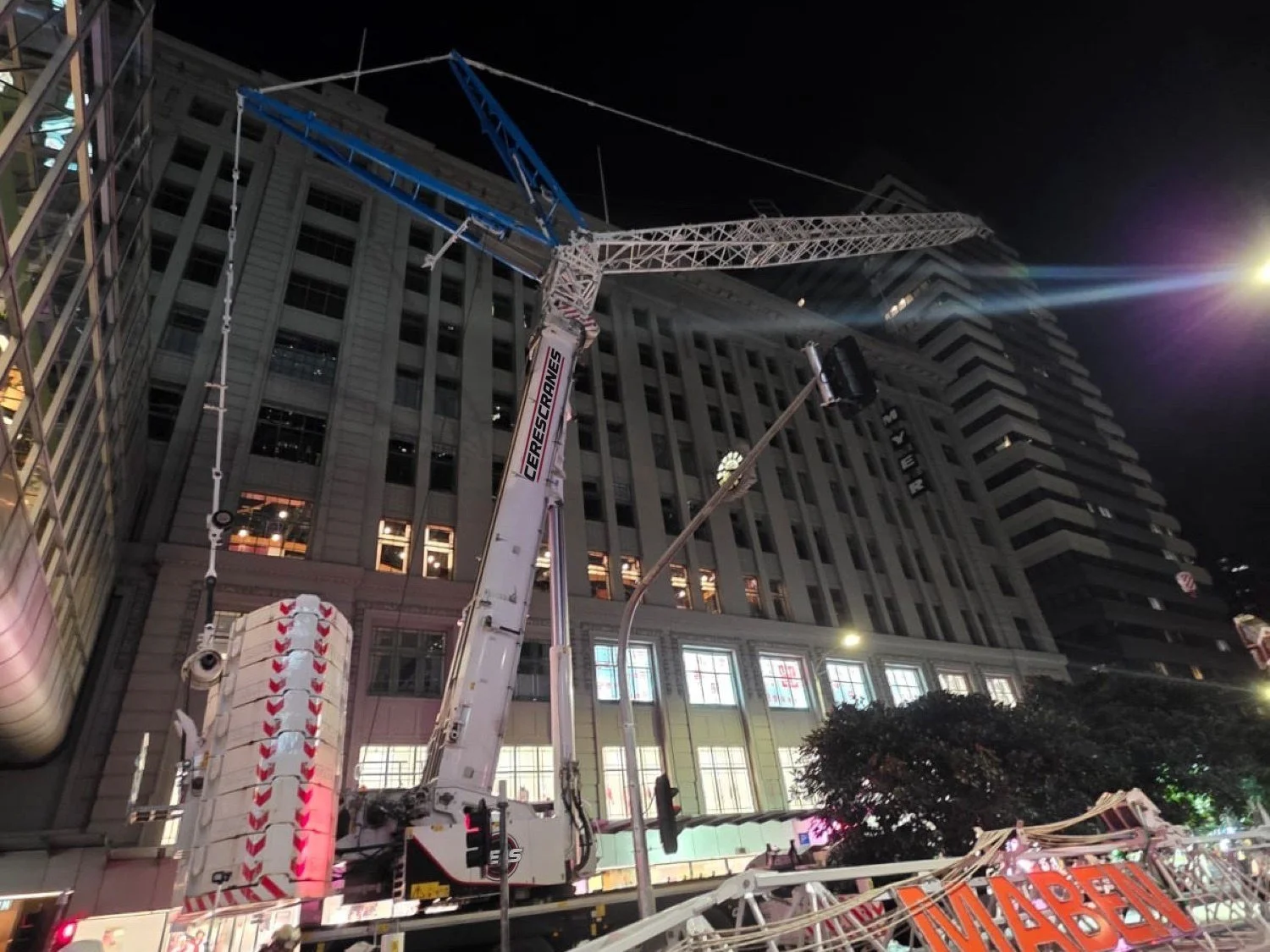 Ceres Cranes mobile crane assembling a tower crane at night in Melbourne