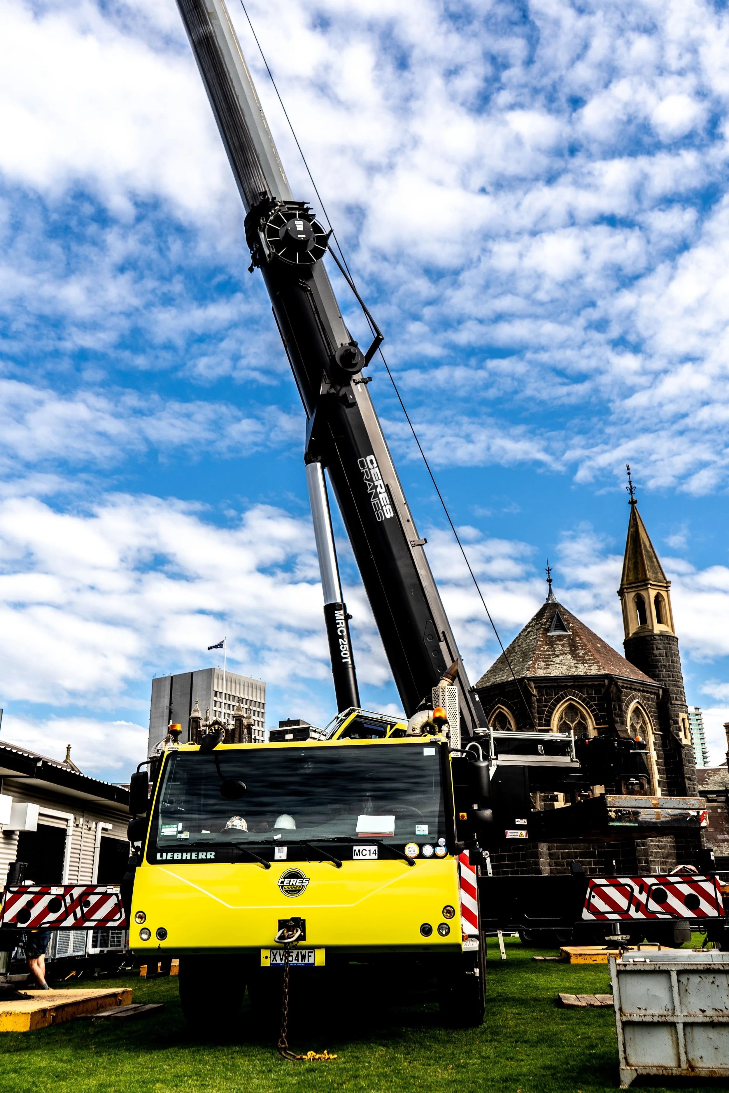 Ceres Cranes all-terrain crane set up beside a historic church