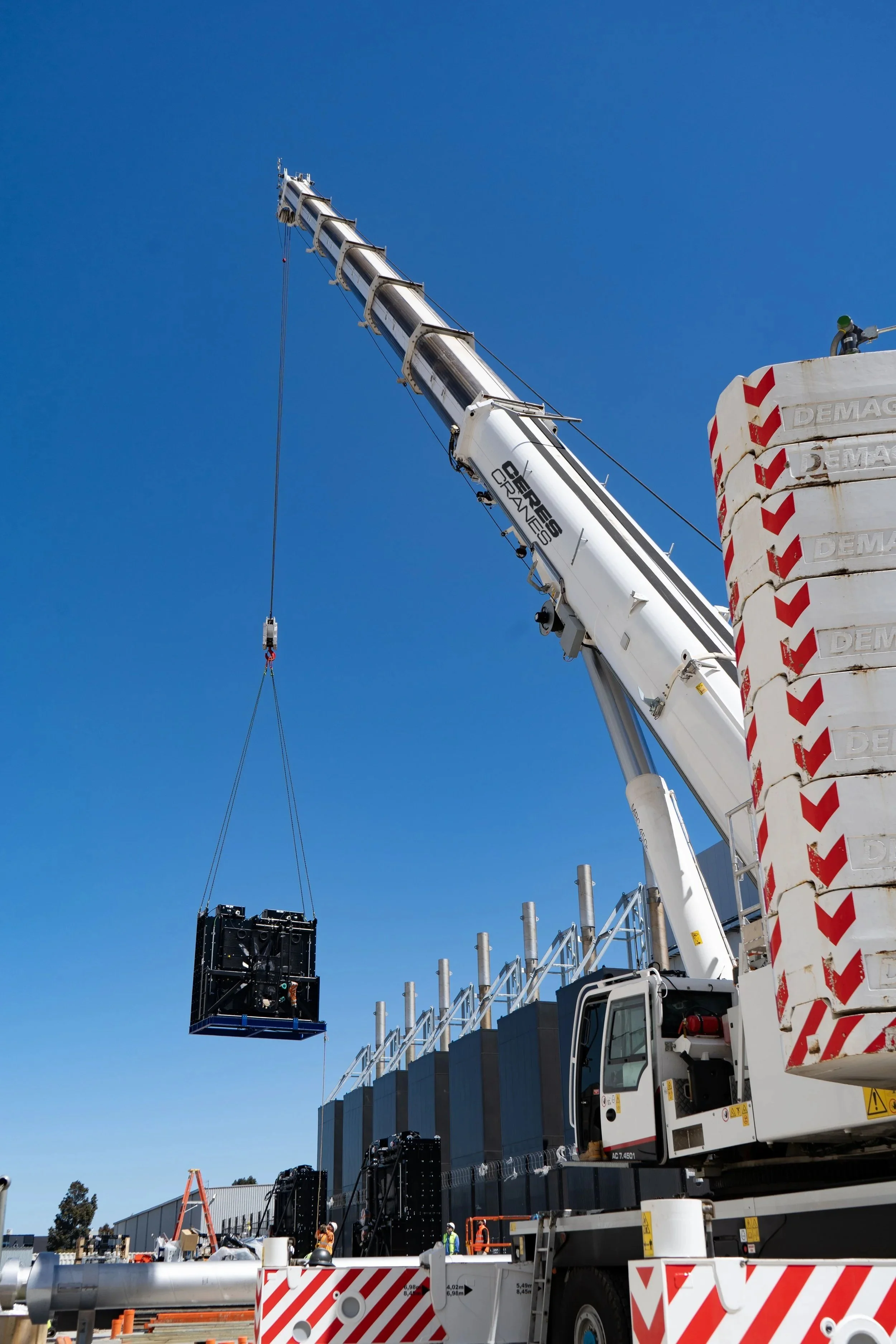 450T Tadano Demag crane lifting plant equipment onto a building
