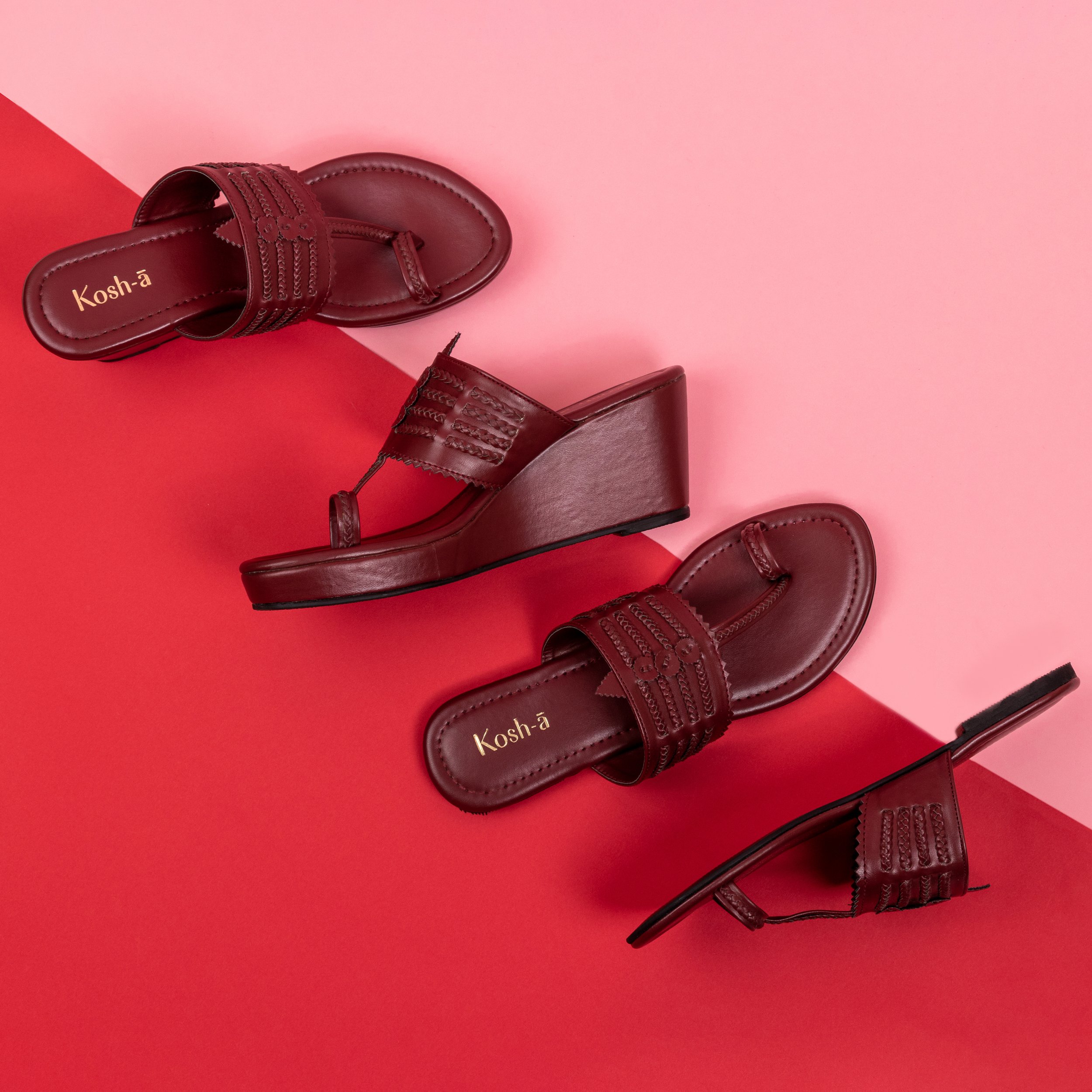 A top-down image of two pairs of red vegan wedges for women