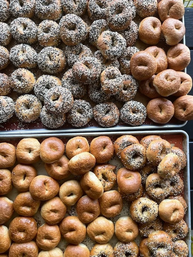 Rows of fresh-baked everything bagels at Colette Bread & Bakeshop in Atlanta