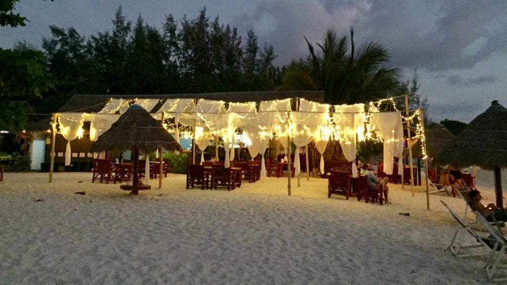 Wooden chairs and tables under bright lights