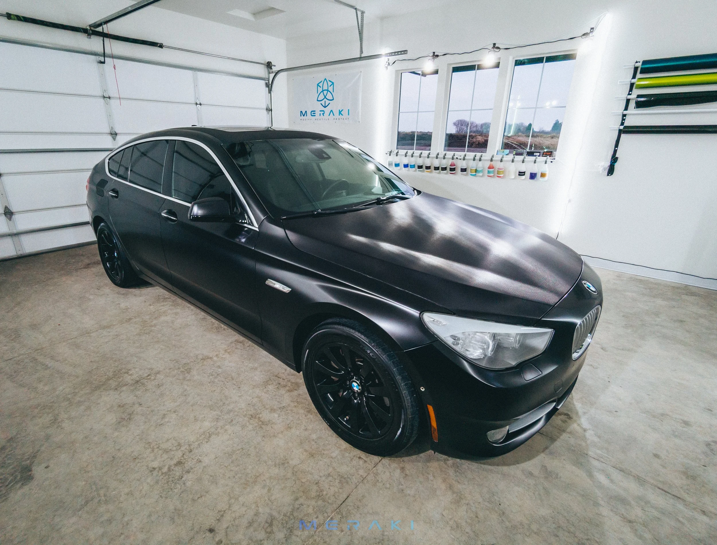 satin black vinyl wrap bmw 550i