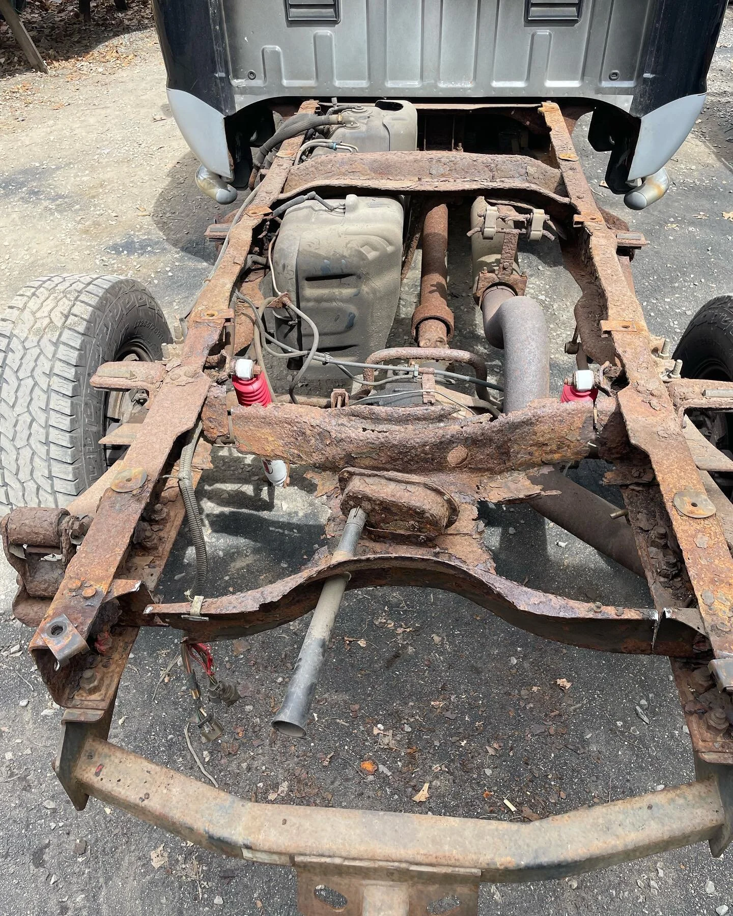 This 2002 Ford F-250 needed some attention, the rear spare tire holder was completely rotted away need to cut out and fab one up, also needed to fix rear section of frame and replace leaf spring hangers and shackles, frame also got blasted epoxy prim