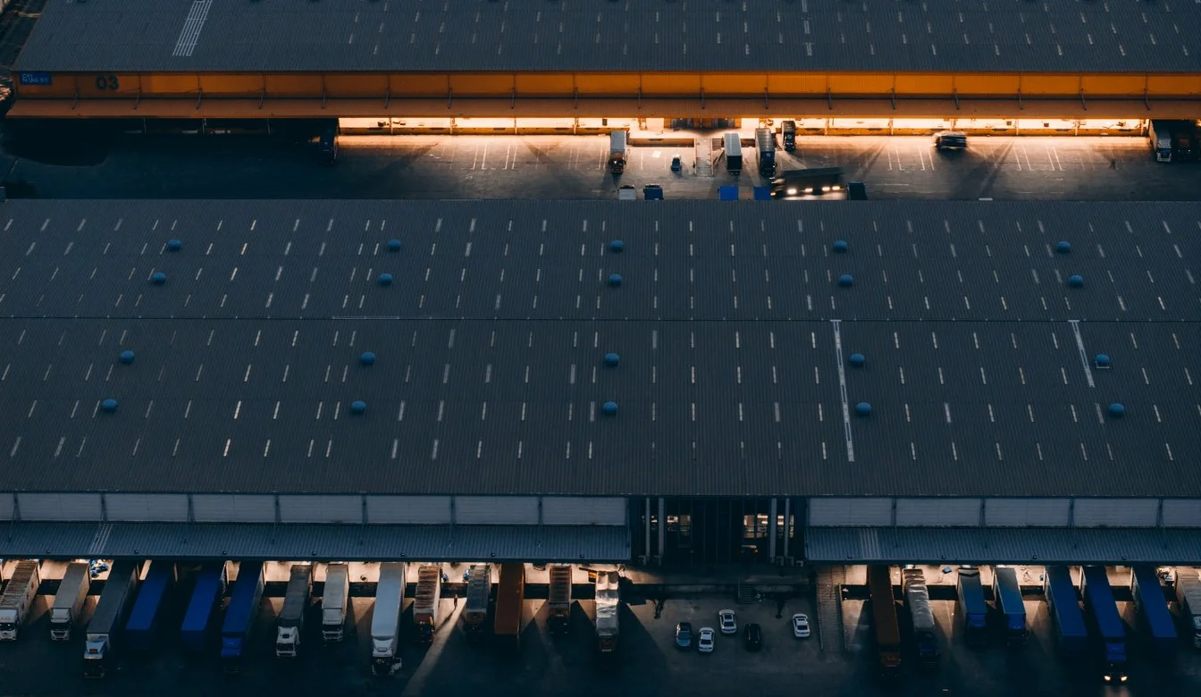 business people in conference room through window at night