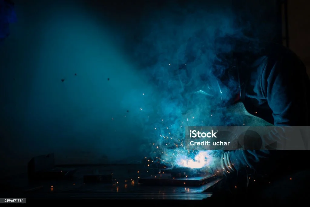 business people in conference room through window at night
