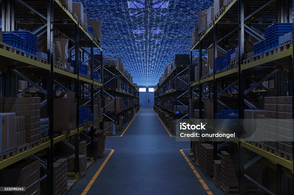 man using a digital tablet while working in a server room