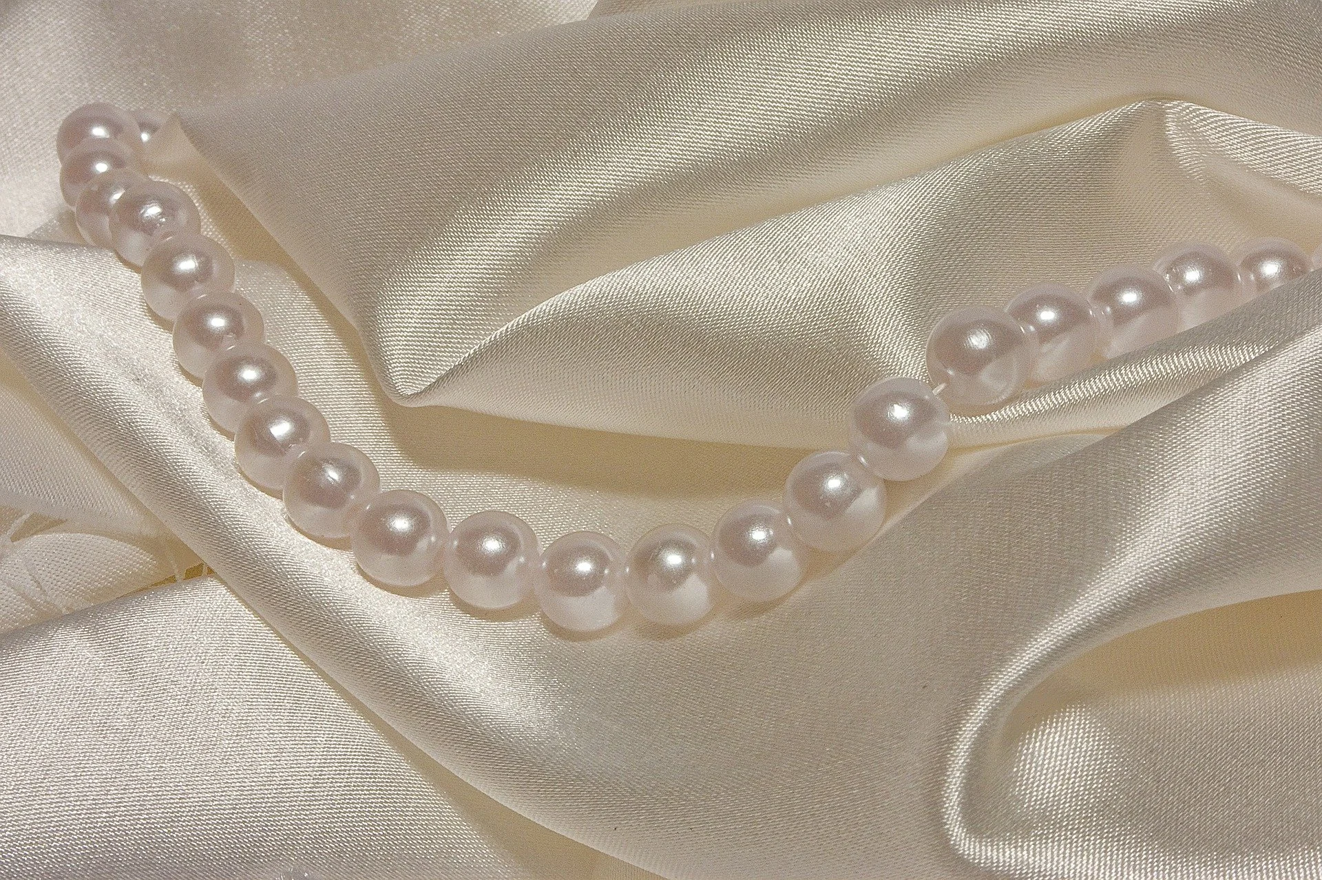 string of pearls on silk