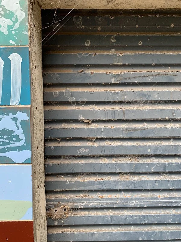 Garage door needs a clean and paint.