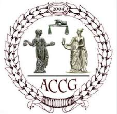 Emblem with two classical statues, one male and one female, facing each other, with a scale above them, surrounded by a laurel wreath, and the year 2004 at the top, with the letters 'ACCG' below.