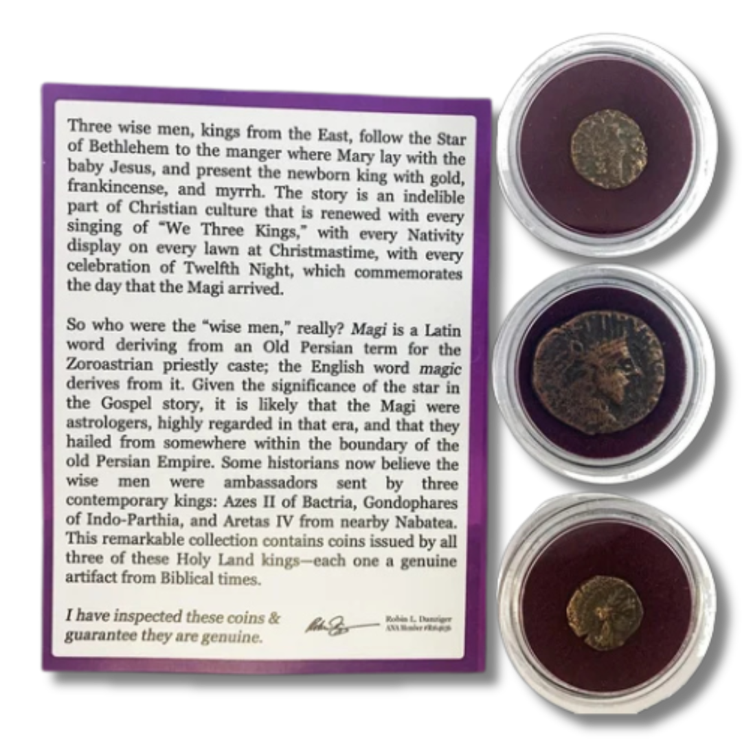 Three ancient coins in protective cases displayed next to a descriptive informational card about their historical significance and authenticity.