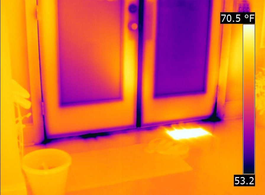 Thermal imaging showing heat loss around a window frame due to air leakage and poor sealing