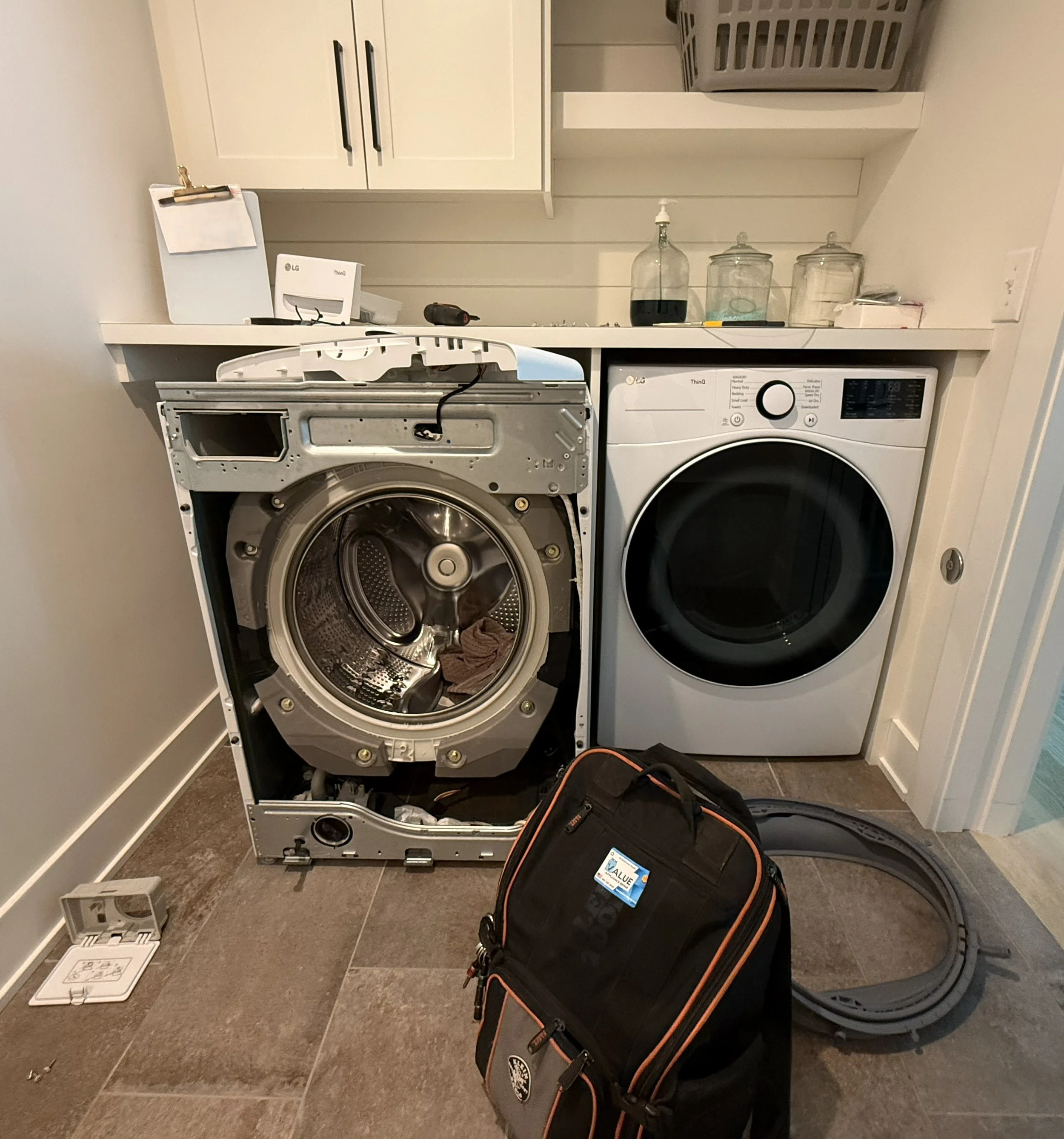 A laundry room with front-loading LG washing machines and dryer repair Minnesota