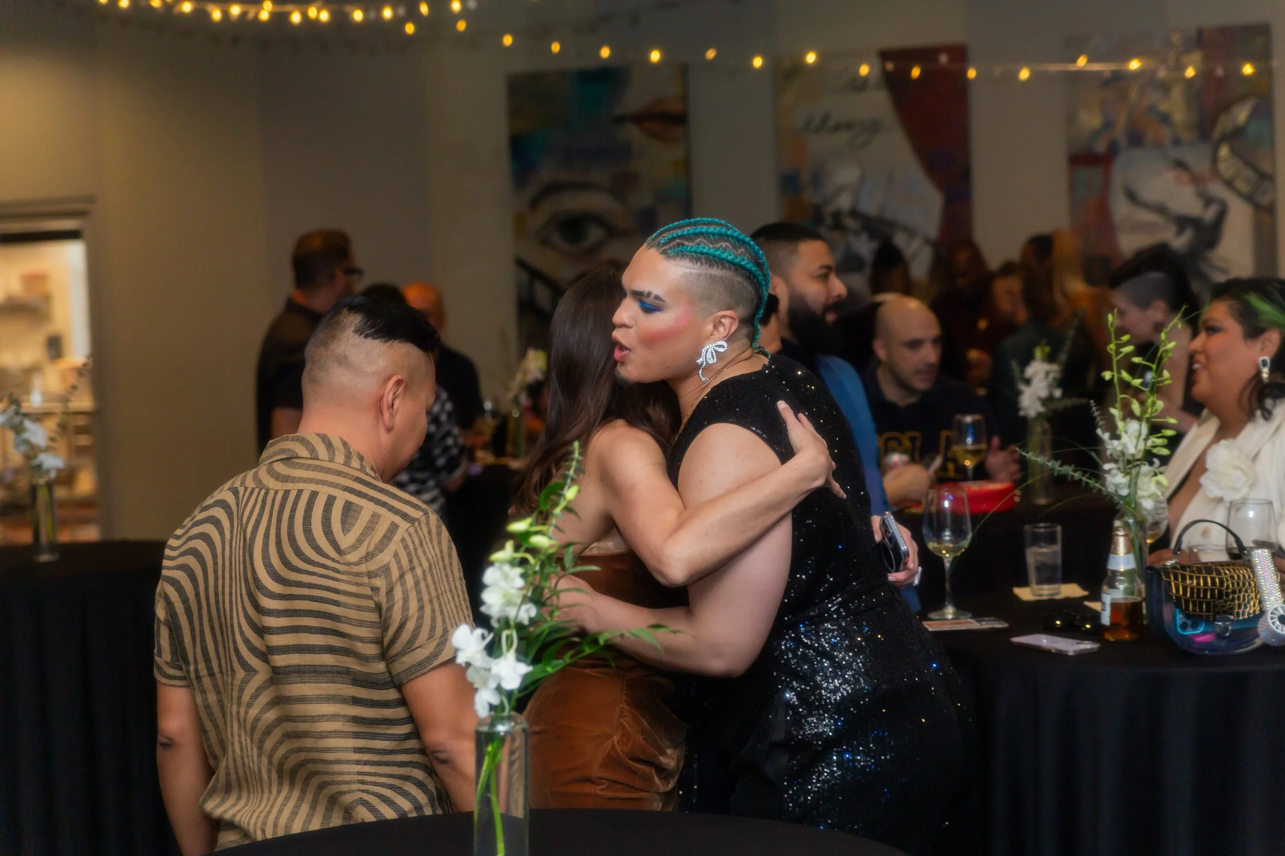 Event guests mingle and embrace