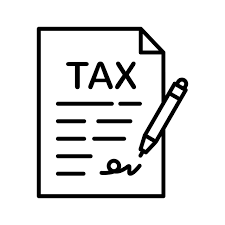 Tax document with a pen signing it