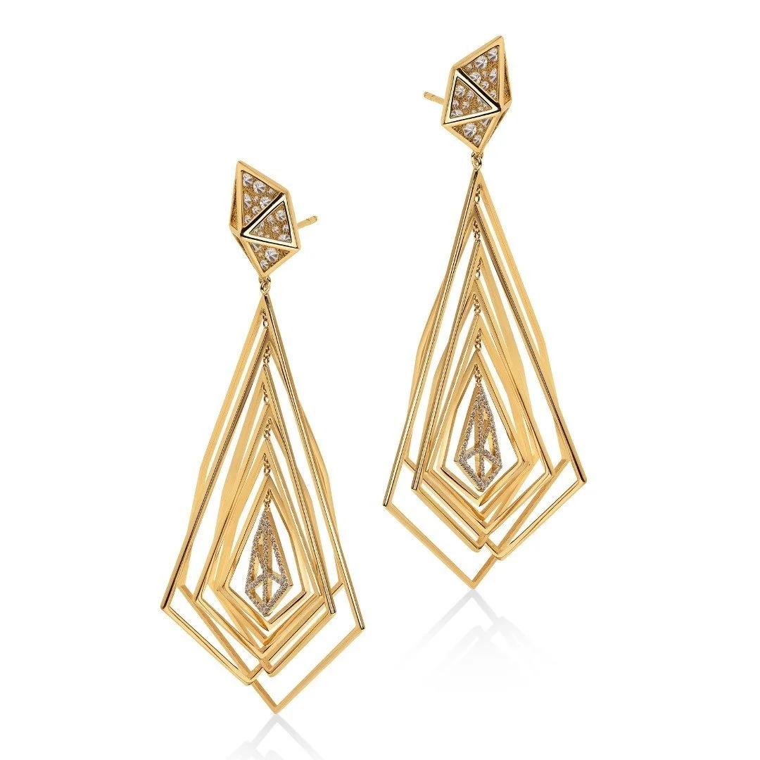 From the striking Shattered Collection, the Orbit Earrings captivate with their ever-changing brilliance. Reverse-set diamonds enclosed in a pyramid radiate an otherworldly charm, making every movement a mesmerizing display of light and luxury. Craft