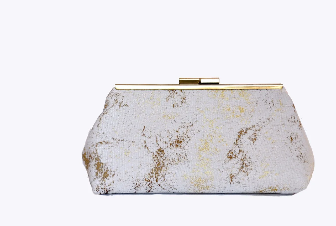 White and gold holiday clutch