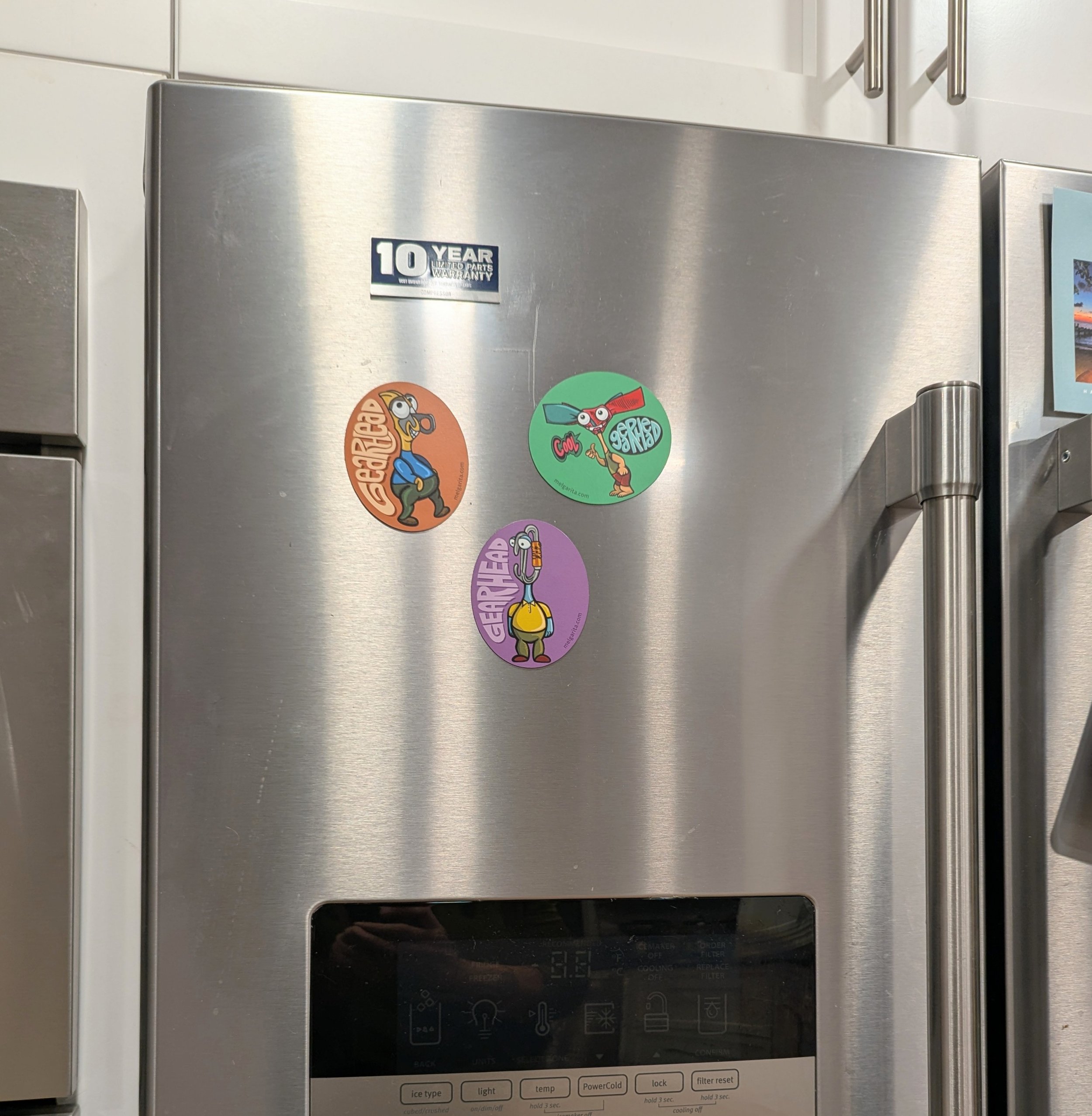 3 gearhead magnets on fridge2.jpg