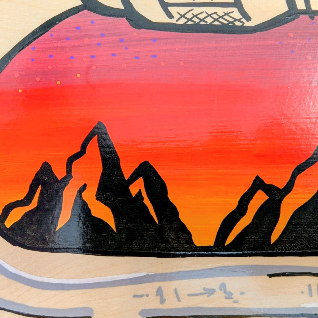 Mountain sunset in carabiner art close up.png