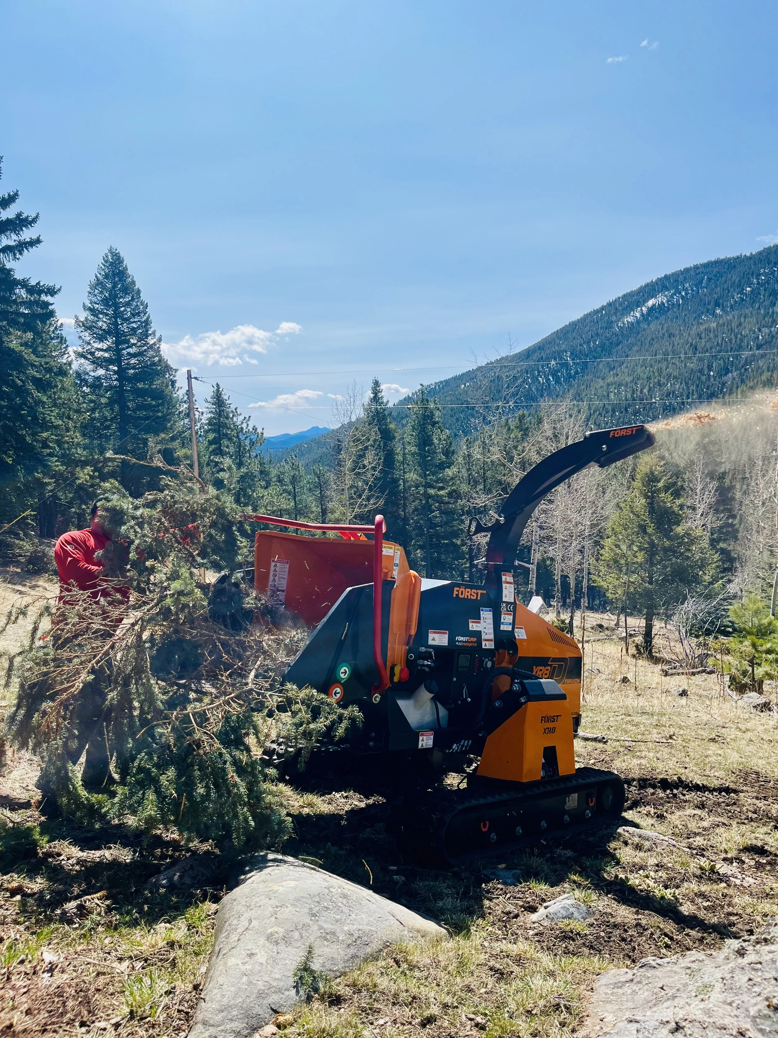 A Först tracked wood chipper being used for wildfire mitigation in Evergreen Colorado 