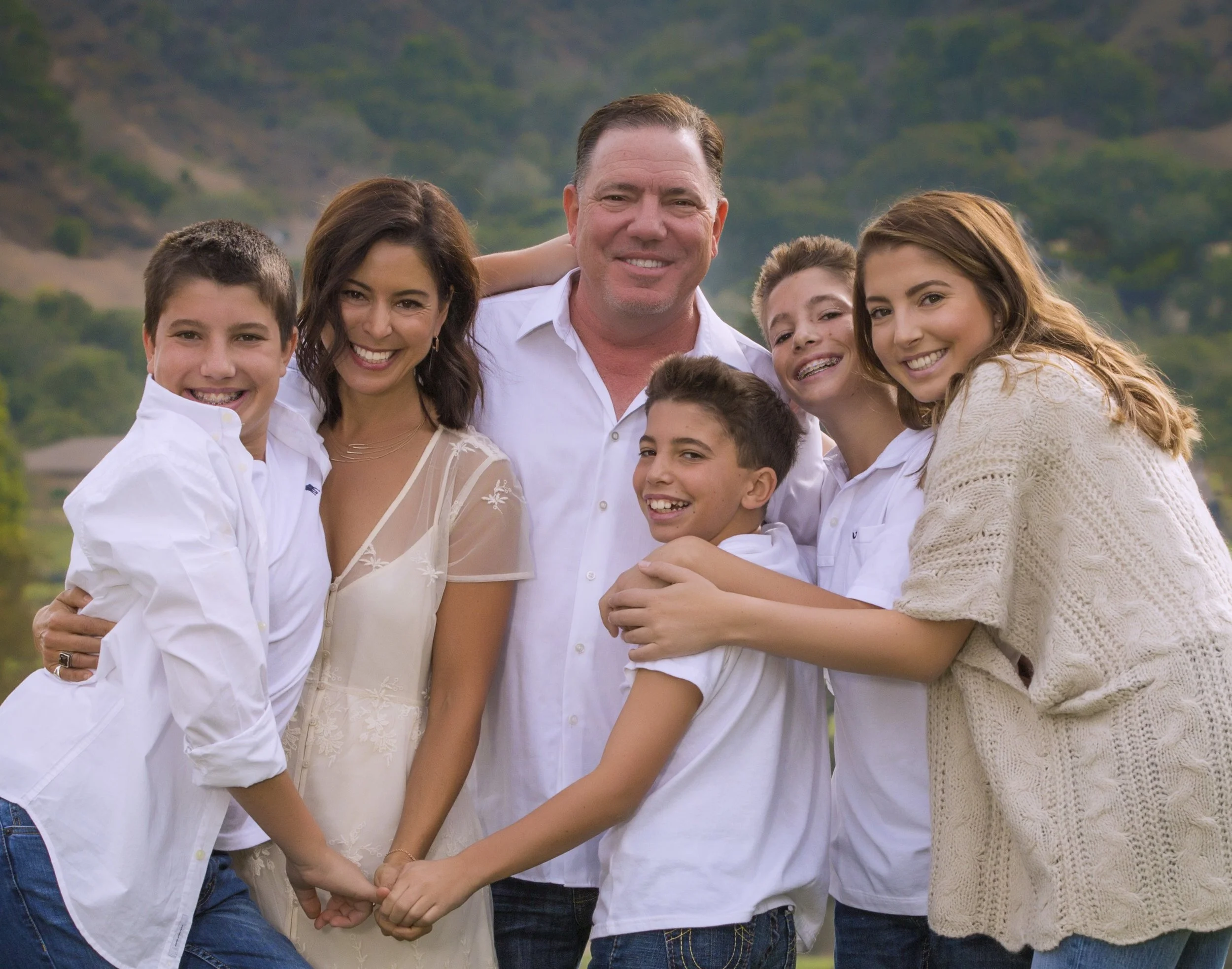 The Silacci Family Session  Mom has embraced me as their family photographer allowing me to take senior pictures of all of their kids to date.  Their love for each other and for having fun shows in this picture!