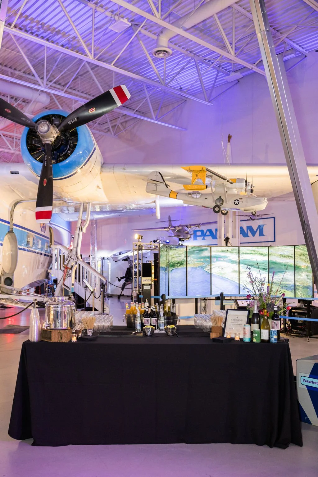 Hiller Aviation Celebration of life bar under a plane