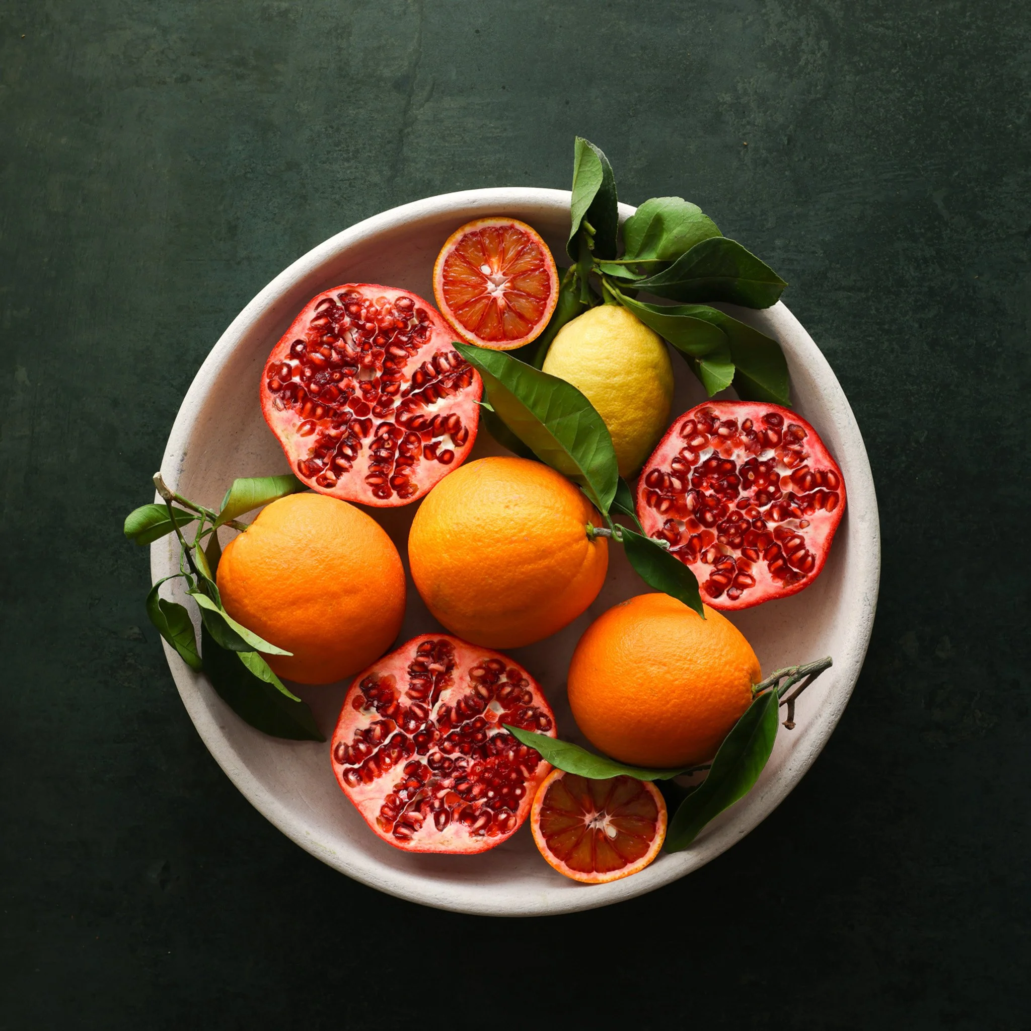 Pomegranate and orange fruit bowl food photography and content creation 