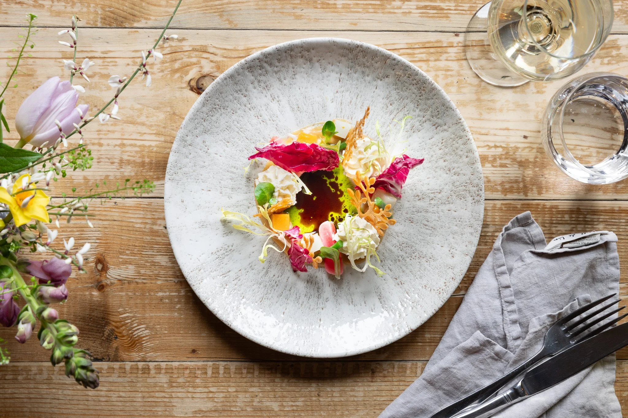 A plate of spring salad lifestyle photography for  restaurant The Bell, East Sussex