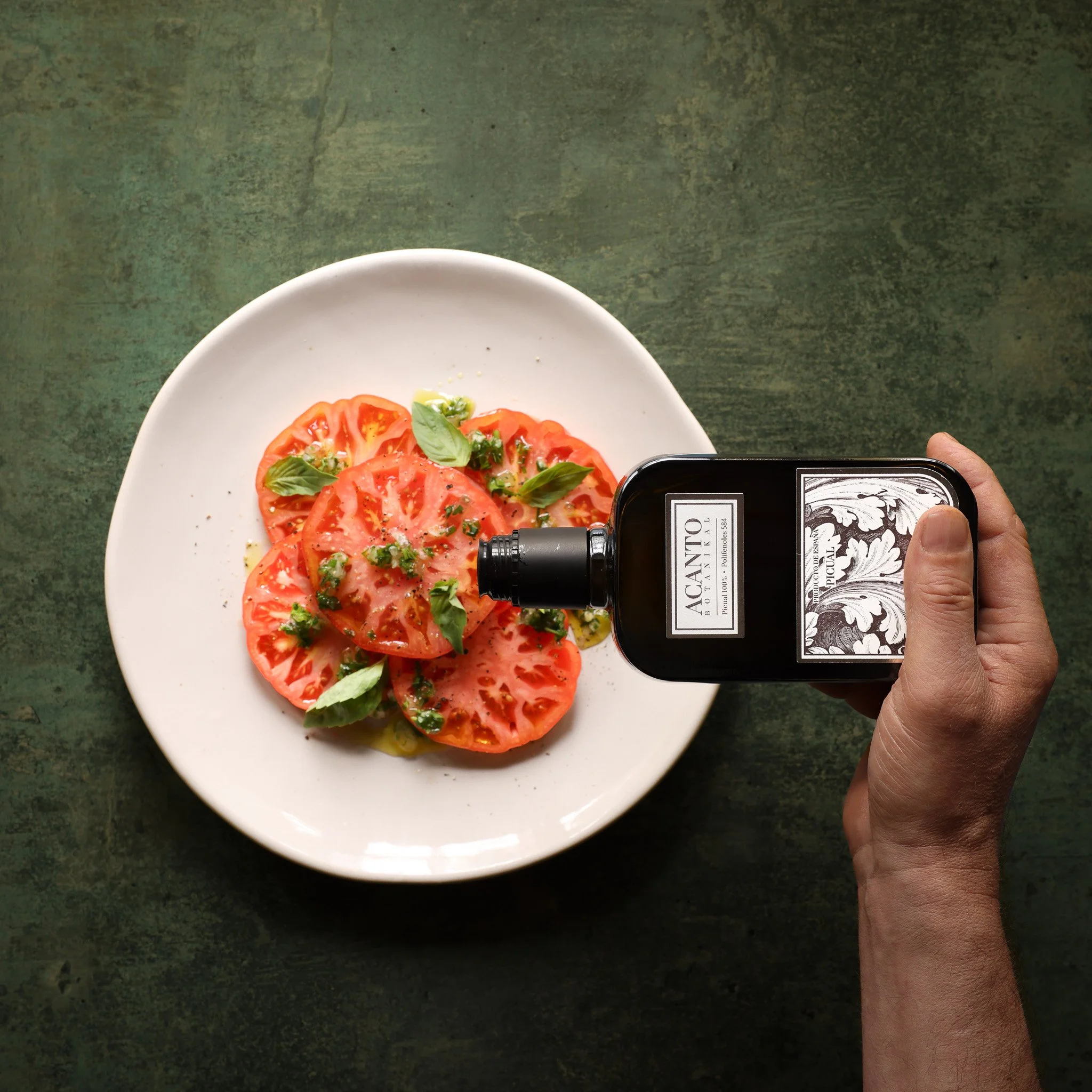 A plate of heirloom tomatoes with olive oil, photographed for luxury UK food brand Fine & Wild 