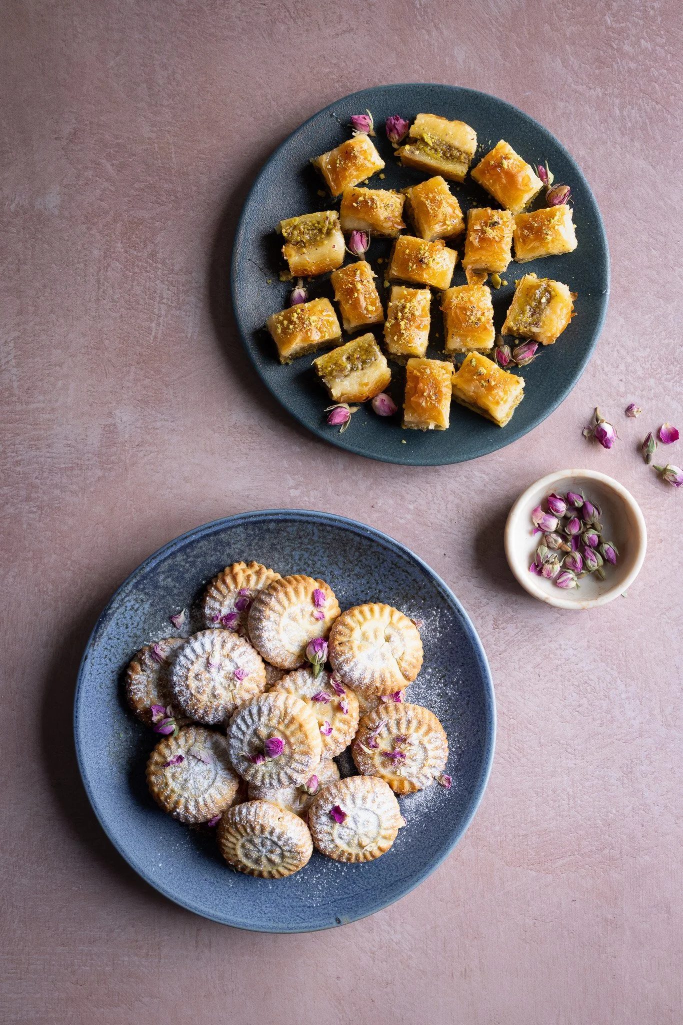 Plates of baklava and maamoul styled and photographed for Mamoosh UK brand