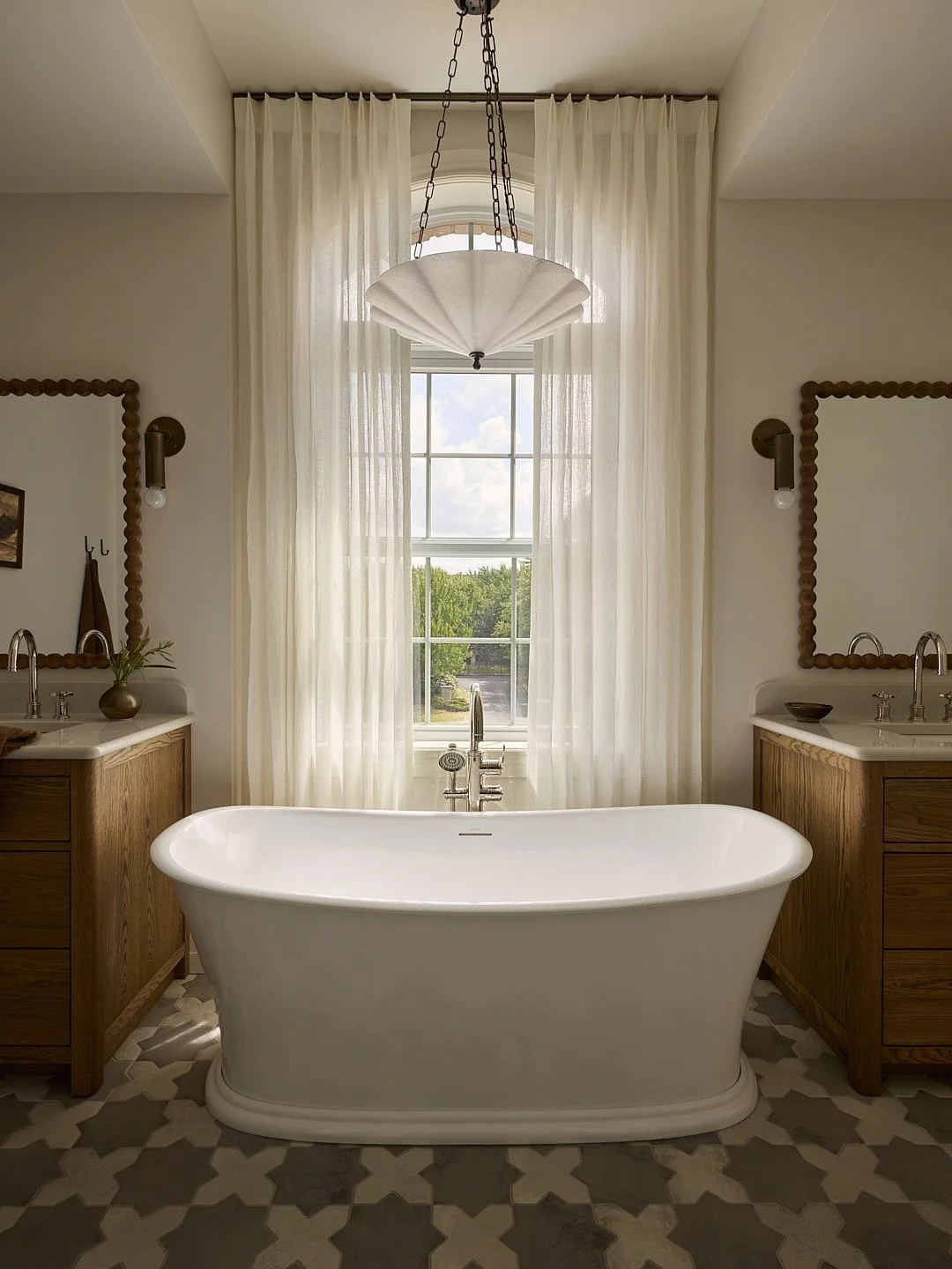 Who said a kids&rsquo; bathroom couldn&rsquo;t be refined? ✨
We wanted this one to feel playful &mdash; with whimsical light fixtures, sculpted mirrors, and patterned tile &mdash; yet still quietly elegant. A space that feels joyful today, and will a