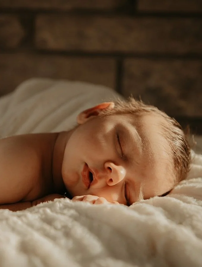 sleeping newborn baby wrapped in blanket natural lifestyle newborn photography Ontario