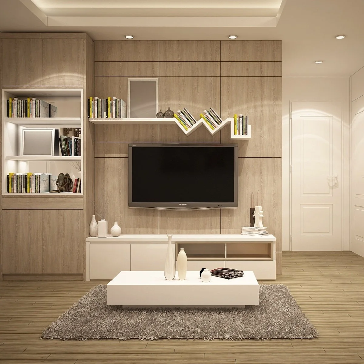 Salon moderne avec mur en bois, télévision à écran plat, étagères blanches avec livres, décor en blanc, tapis gris, objets décoratifs en blanc, cadres, et une porte blanche.