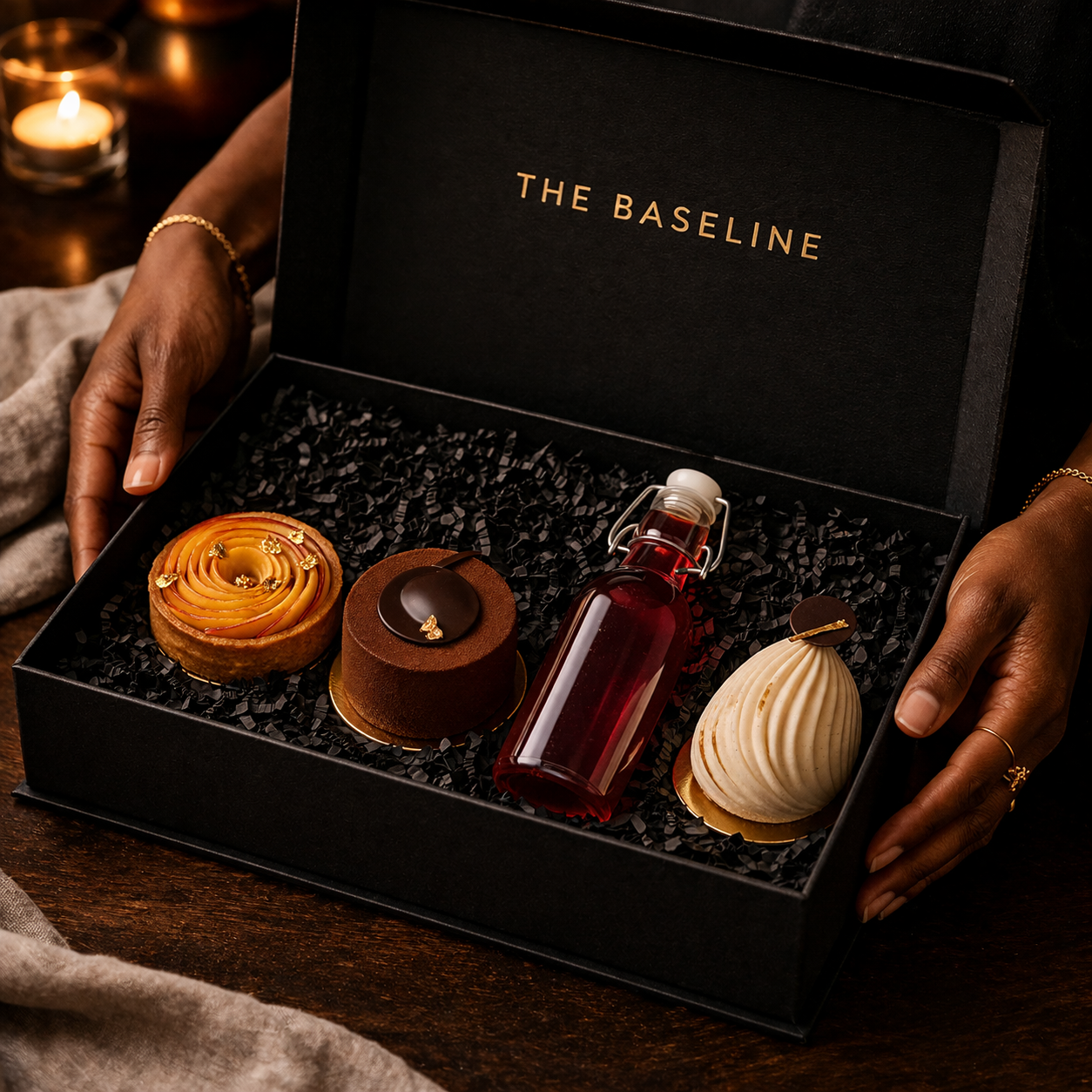 Elegant gift box with luxury desserts.png