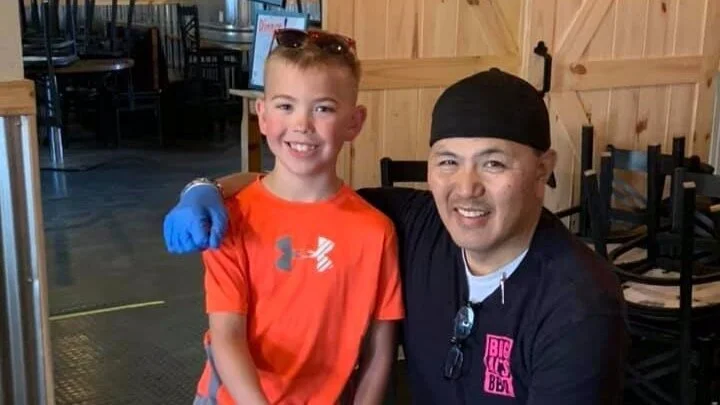 A picture of Al Laudencia and his son.