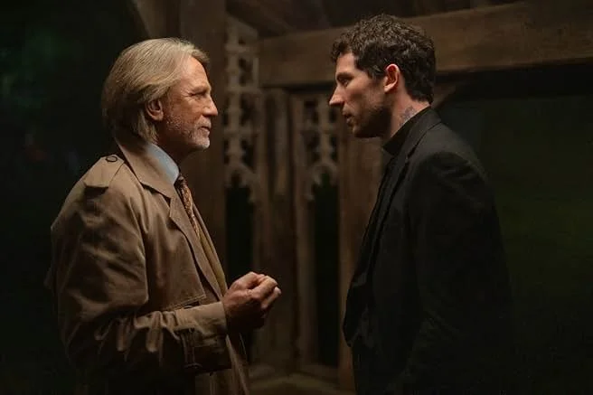 Young priest, Rev. Jud Duplenticy (Josh O'Connor), and atheist detective, Benoit Blanc (Daniel Craig), in Wake Up Dead Man: A Knives Out Mystery (Netflix, 2025).